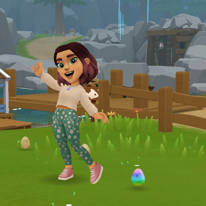 Tara showing off a rainbow egg laid buy a magical chicken.