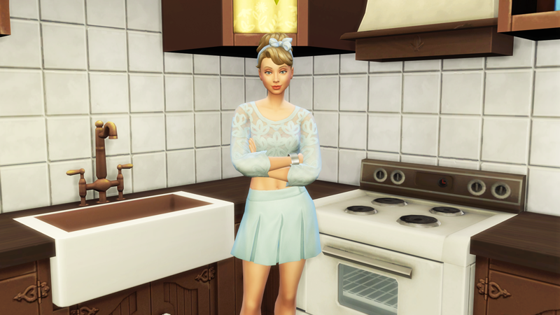 A sim styled as Cinderella, stood in a kitchen, for the Sims 4 Disney Princess Legacy Challenge.