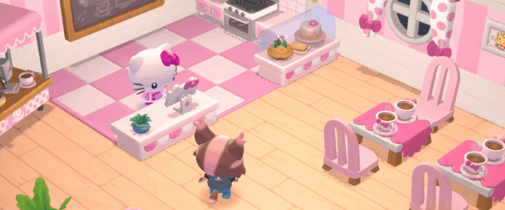 An image of Hello Kitty behind a counter in a pink cafe.