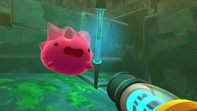 Pink rock slime in Slime Rancher which is round and pick with grey spikes.